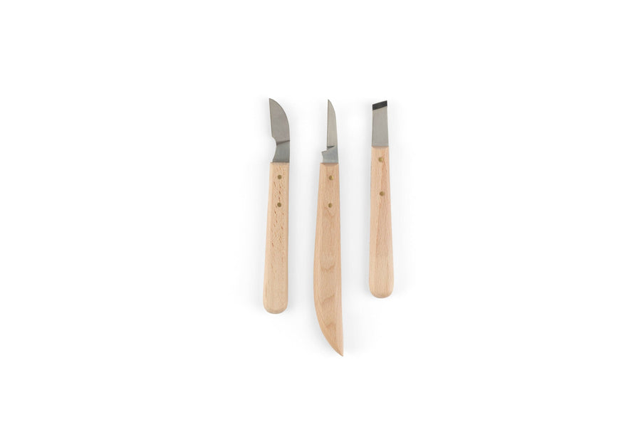 The MHG Wood Carving Knife Set by MHG features three knives with ergonomic handles and varied high-carbon steel blades, displayed vertically on a plain white background.