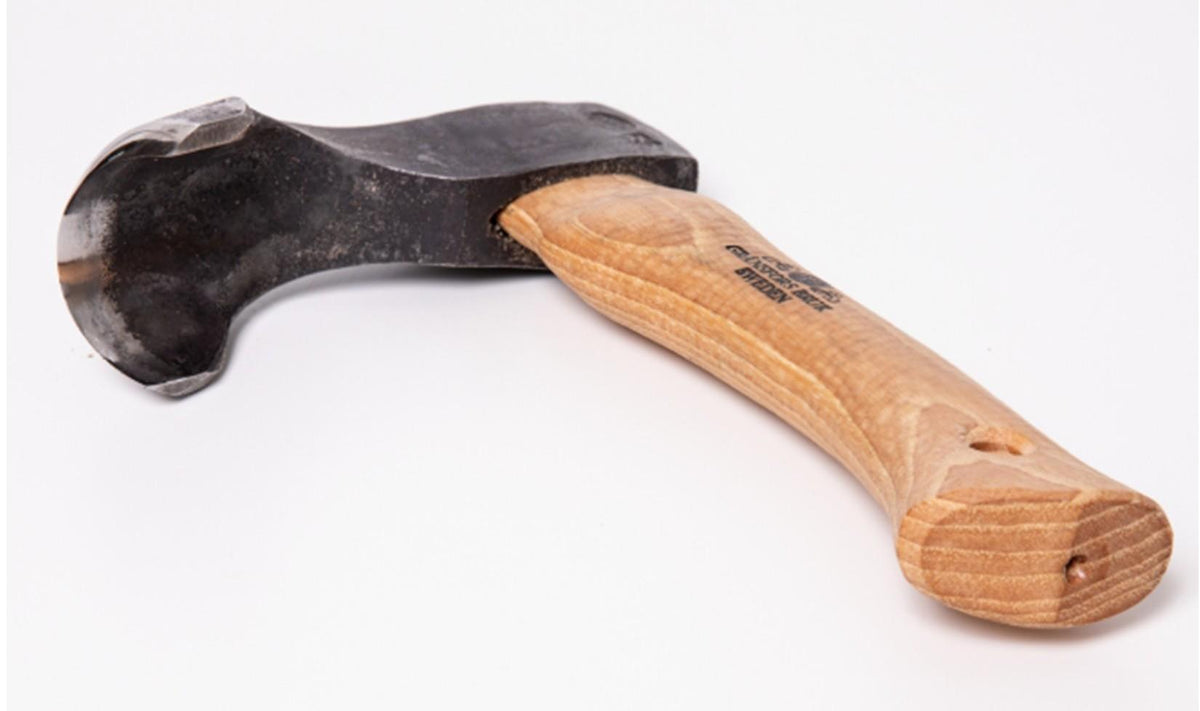Featuring a curved wooden handle and a wide, rounded black metal blade designed for hollowing or shaping wood, the Gransfors Bruk Small Gutter Adze Radius 25, Second Grade by Gransfors Bruk is pictured against a white background.