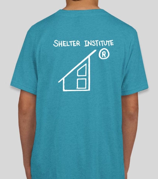 The person is wearing a Custom Ink 50th Anniversary Youth T-Shirt featuring a white house logo on the front and "Shelter Institute" on the back.