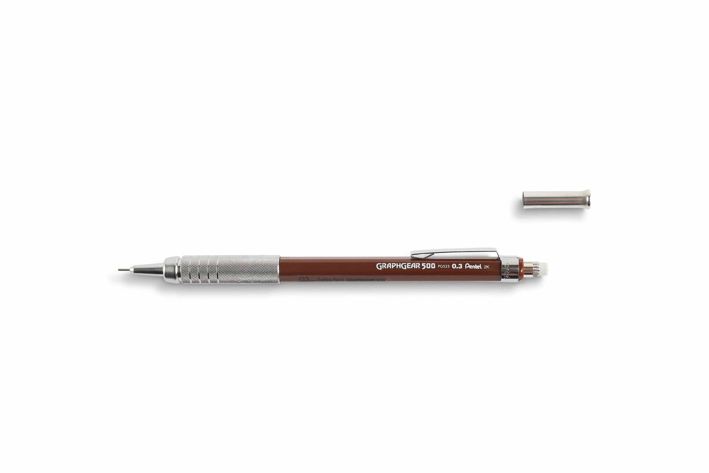 The GraphGear 500 Mechanical Pencil by Dick Blick, featuring a brown barrel, metal grip, and clip, is displayed horizontally on a white background with its cap removed. Its design ensures precision for drafting with the ideal lead size.