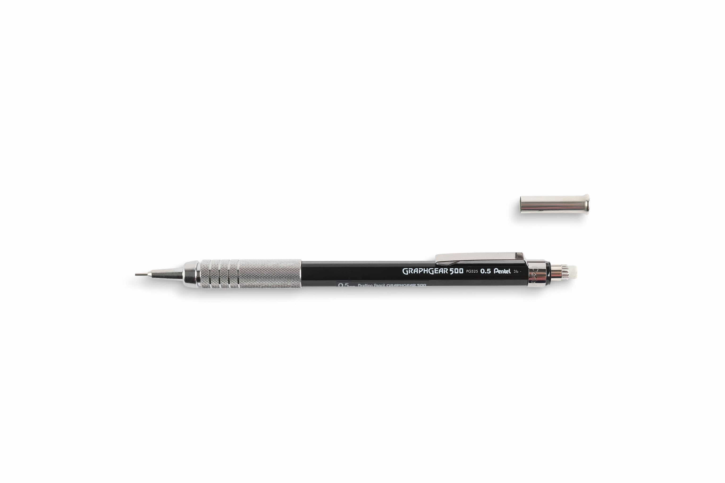 The Dick Blick GraphGear 500 Mechanical Pencil, ideal for drafting, lies horizontally with a glistening metal grip. Its cap is above it, revealing a fine lead for precision.