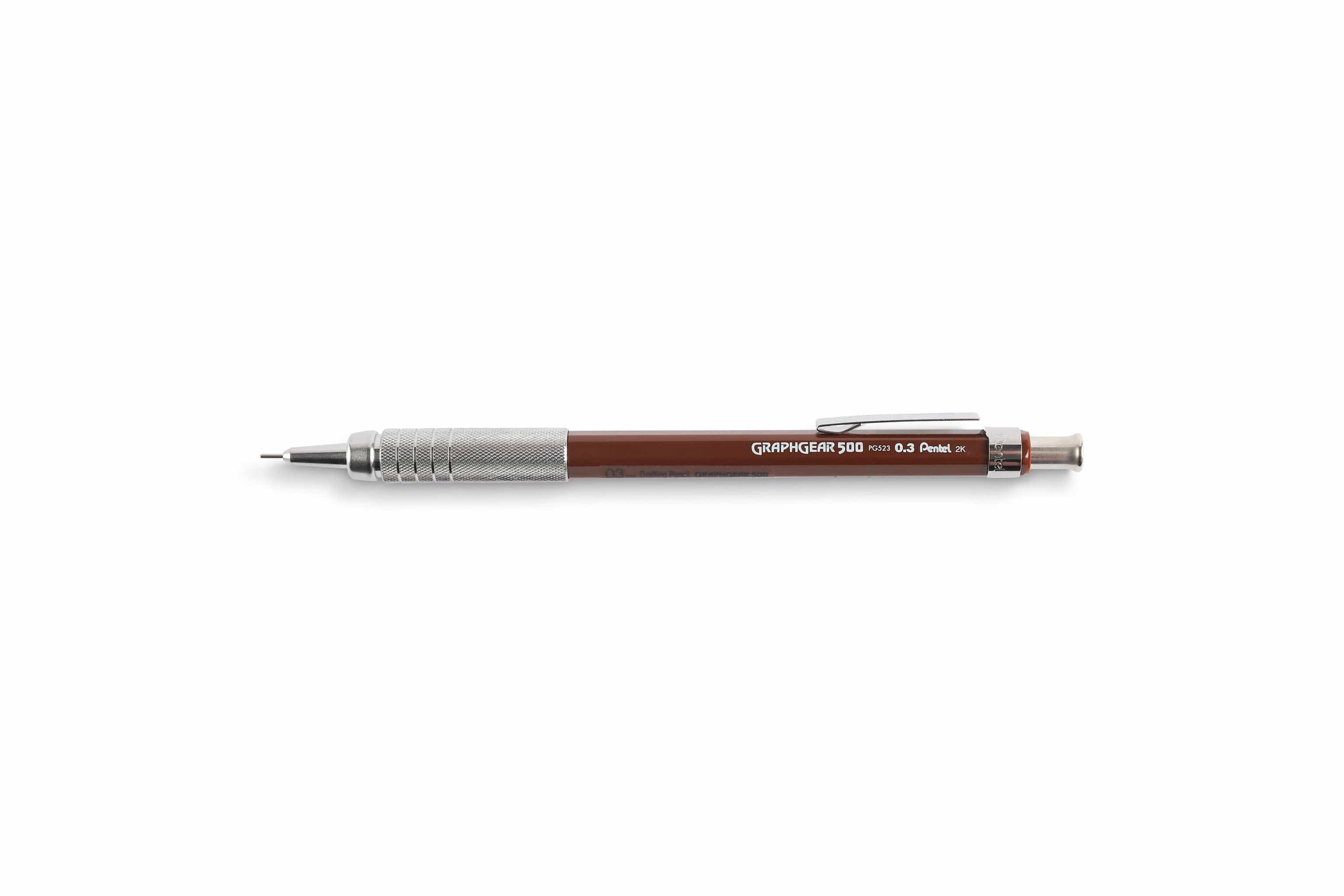 The Dick Blick GraphGear 500 Mechanical Pencil, with a brown body and silver grip and tip, is perfect for precise drafting. It features GRAPH GEAR 500 in white text and uses Hi-Polymer lead for smooth writing and crisp lines.