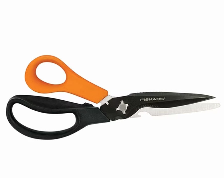 The FIS Multi Purpose Garden Shears have one orange and one black handle, precision-ground steel blades, a partially serrated edge, and a built-in gripper near the pivot for heavy-duty garden tasks.