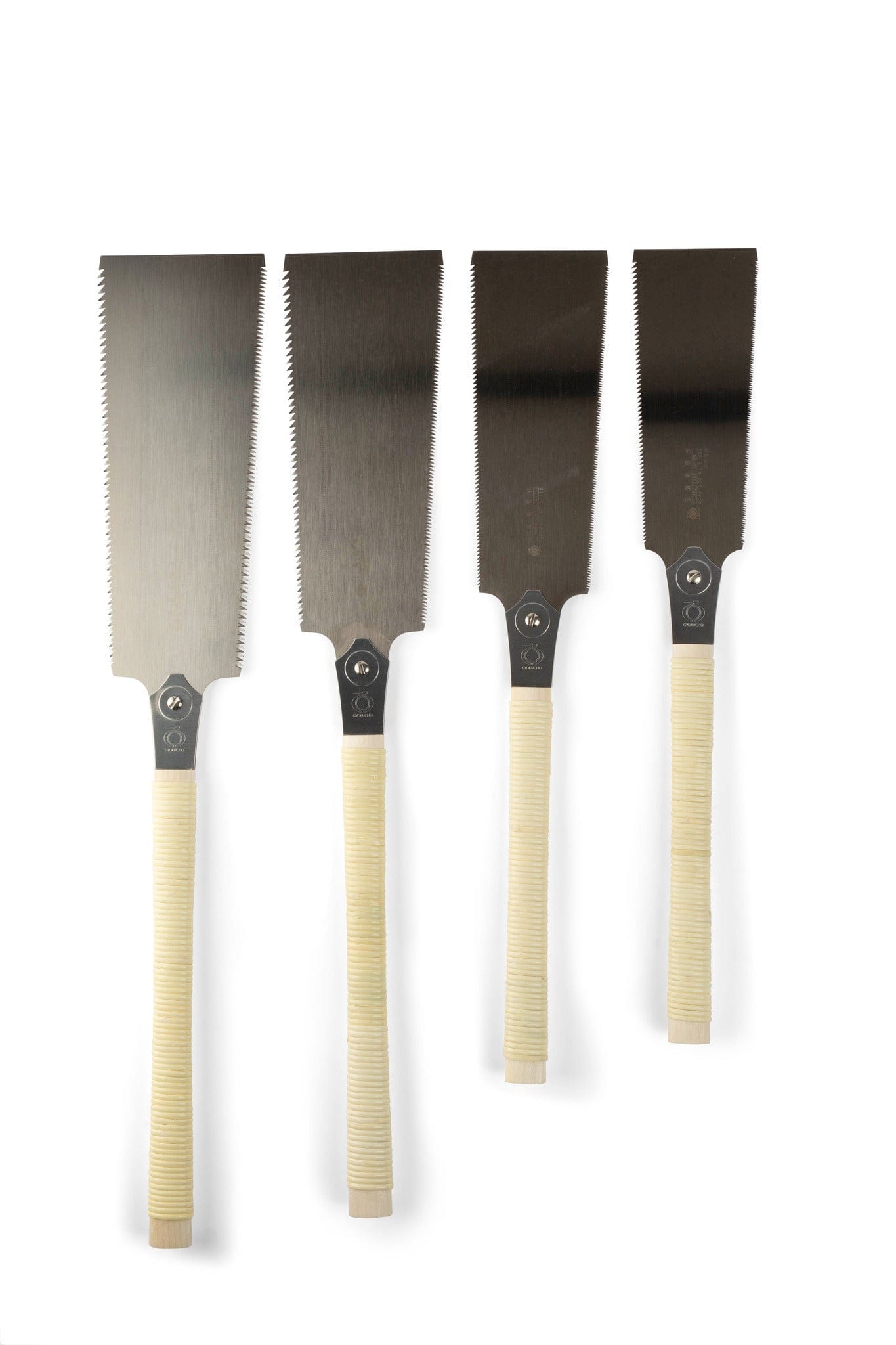Four Gyokucho Ryoba Japanese Handsaws, featuring thin rectangular steel blades and beige wrapped handles, stand upright in a row against a white background, highlighting these essential woodworking tools.