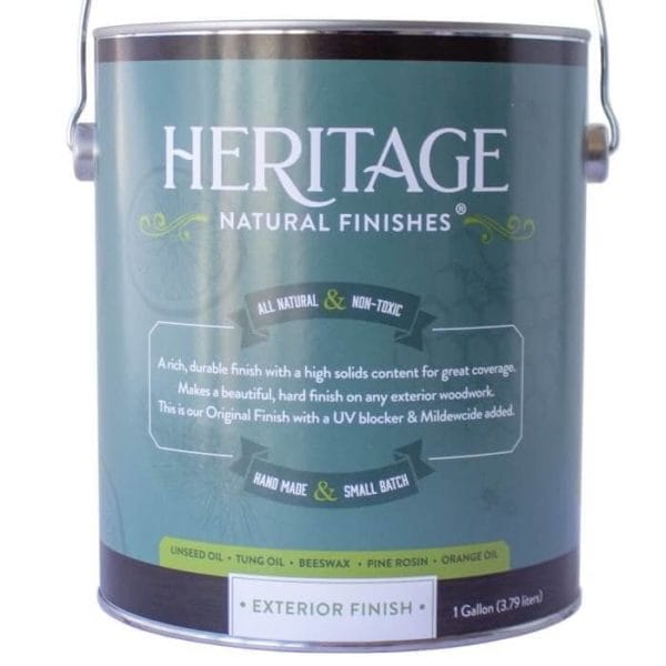 A green can labeled "HNF Heritage Natural Finishes Oil Select Interior OR Exterior" stands against a white background, providing an all-natural, non-toxic wood finish with UV blocker and mildew protection. It contains unseed oil and other ingredients to ensure lasting durability for any exterior surface.
