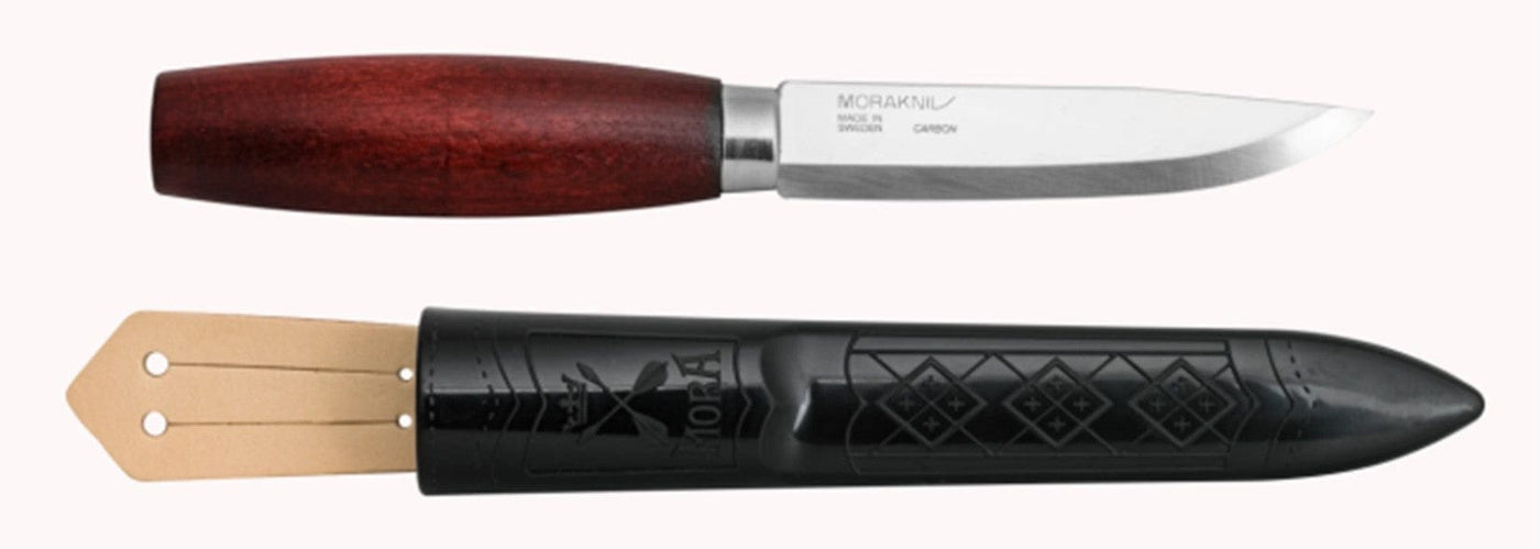 The Classic Mora Knife by Industrial Revolution features a straight blade and a birch wood handle, accompanied by a black plastic sheath.