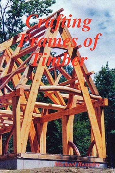 Cover of "Crafting Frames of Timber" by Ingram Content Group, depicting a timber frame under construction with mortise and tenon joinery, set against trees and a cloudy blue sky.
