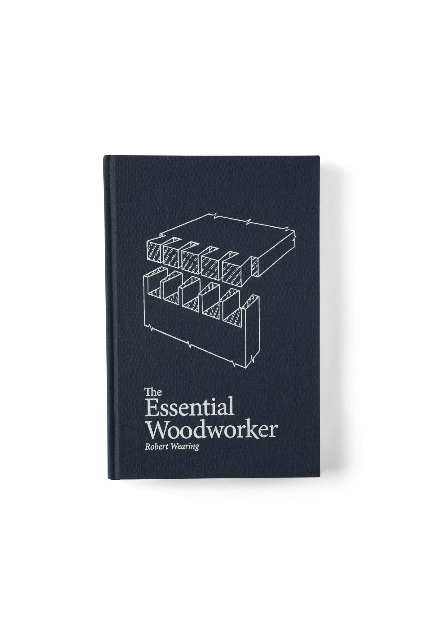 The Essential Woodworker by LAP is a hardcover book with a dark cover featuring a white line drawing of wood joinery—an ideal guide for mastering hand-tool woodworking and traditional techniques.