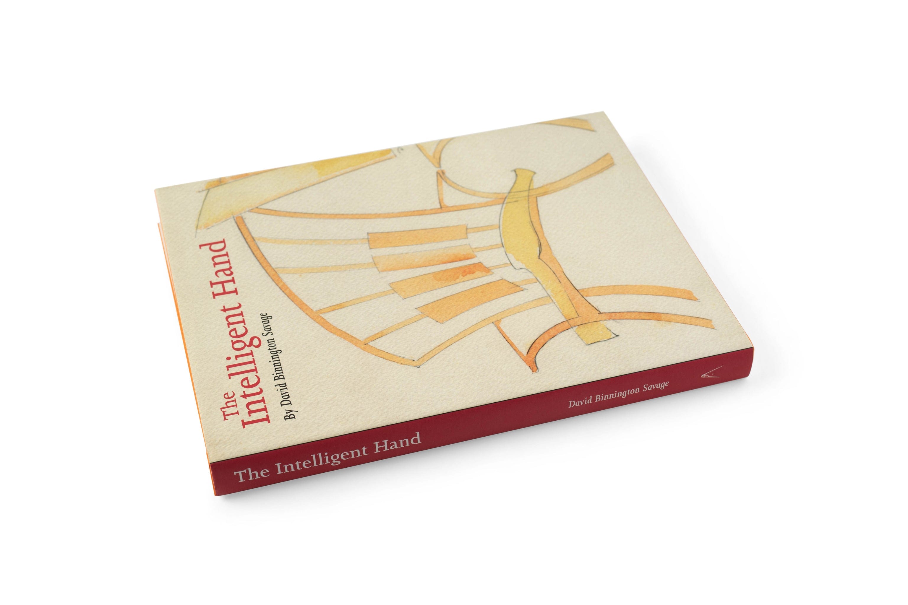 The Intelligent Hand by LAP rests closed on a white surface, displaying its beige cover with an abstract yellow and orange design.