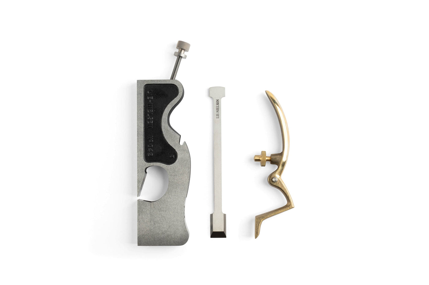 Disassembled components of the Lie-Nielsen Shoulder Plane by Lie-Nielsen include a metal body, chisel-like blade, and curved brass handle with a screw. Ideal for woodworking enthusiasts of shoulder planes.