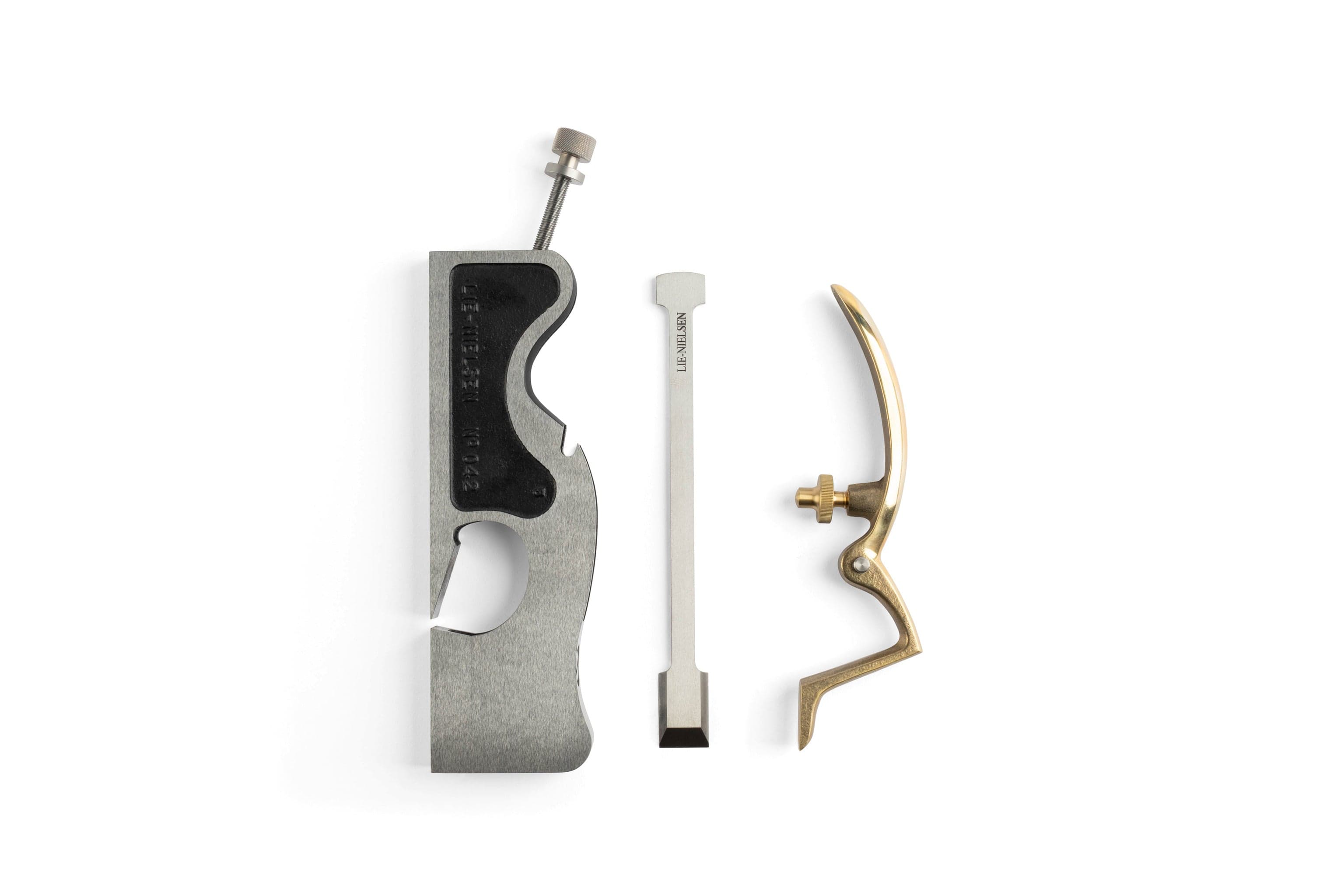 Disassembled components of the Lie-Nielsen Shoulder Plane by Lie-Nielsen include a metal body, chisel-like blade, and curved brass handle with a screw. Ideal for woodworking enthusiasts of shoulder planes.