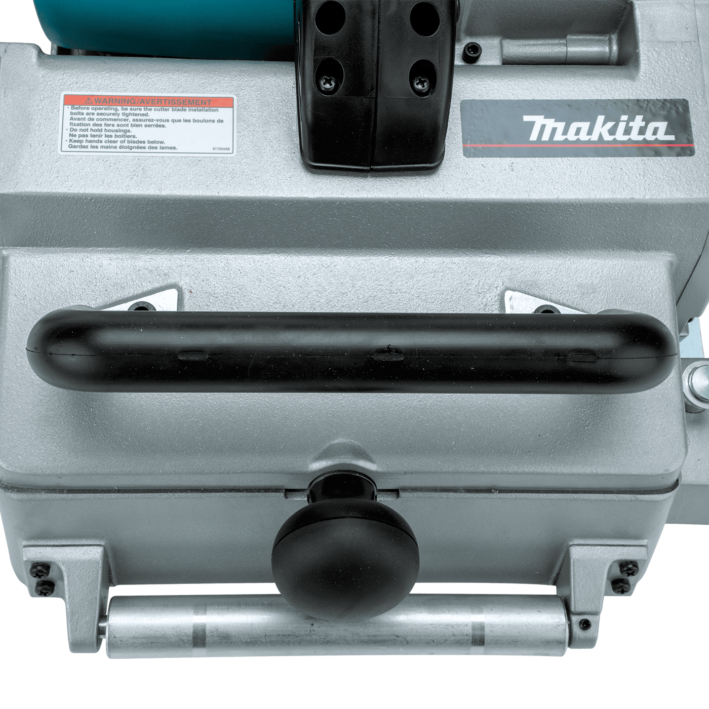 Close-up of the Makita 12-1/4-in Planer, highlighting the Makita logo, warning label, handle, metal body, and control knobs on this powerful tool.