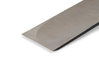 Close-up of the sharp edge and polished, angled bevel of the Maru Japanese Timber Framing Slick blade, showcasing expert Japanese craftsmanship against a white background.