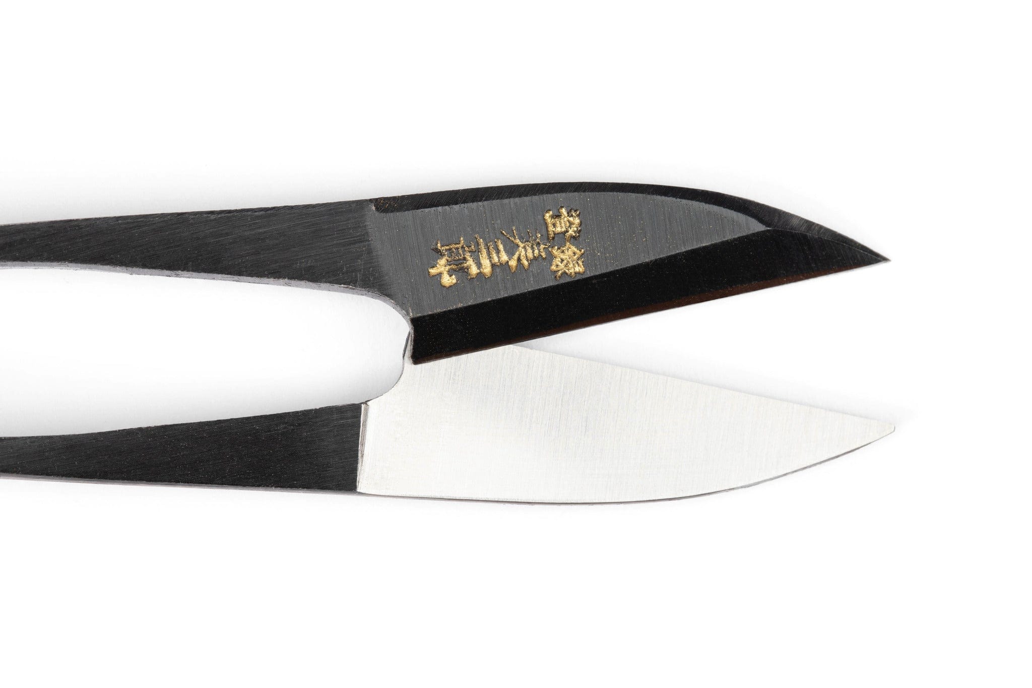 A close-up of MARU Japanese Nigiri Sewing Snips with black handles, featuring a spring-action mechanism and one blade engraved with gold Japanese characters, isolated on a white background.