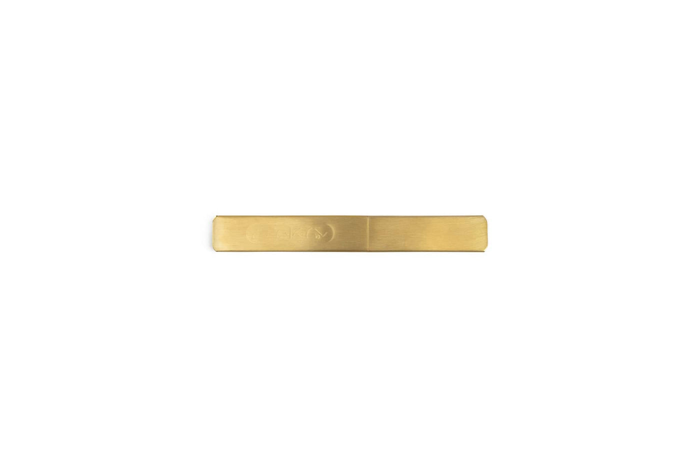 A minimalist, rectangular brass tie clip with a smooth matte finish displayed on white—its clean lines echo the precision of the MARU Japanese Kasaya Marking Knife.