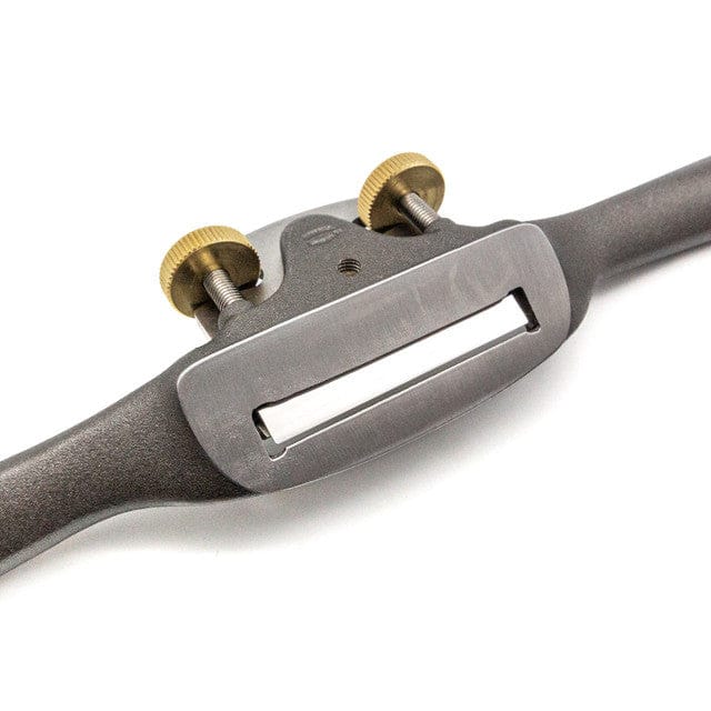 A close-up of the Melbourne Tool Company Sole Spokeshave, a precision woodworking tool featuring two gold adjustment knobs and a central blade—an essential for convex shaping, shown against a white background.