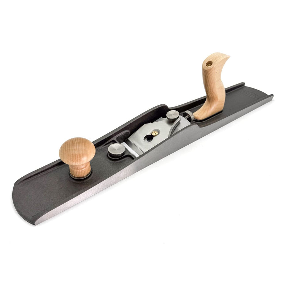 The Melbourne Tool Company's Low Angle Jointing Plane is a precision metal hand plane featuring wooden handles and a long, flat base, ideal for smoothing wood surfaces while ensuring comfort for craftsmen.