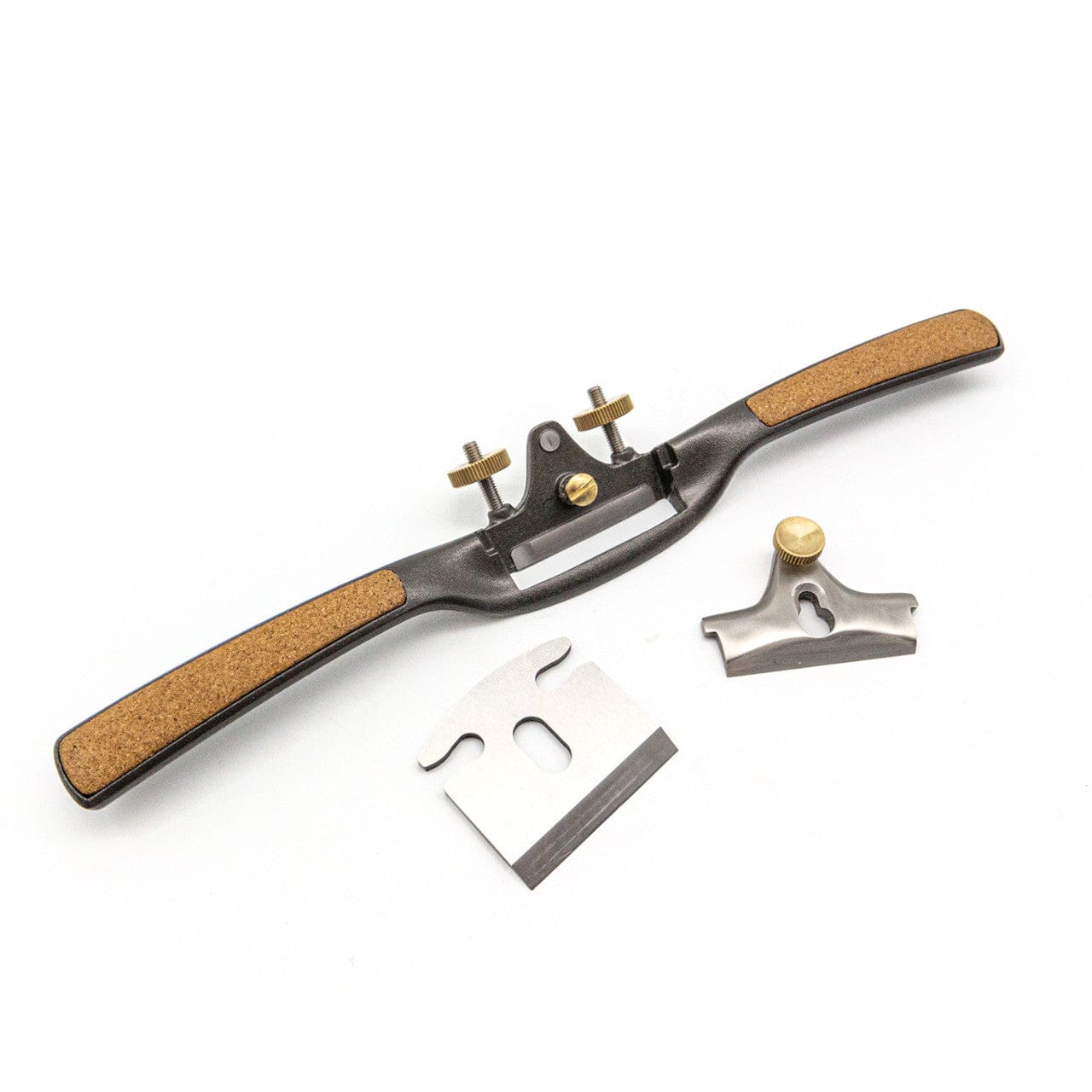The Melbourne Tool Company Sole Spokeshave, a precision woodworking tool, is shown disassembled with cork handles, metal blade, and adjustment parts displayed on a white background.