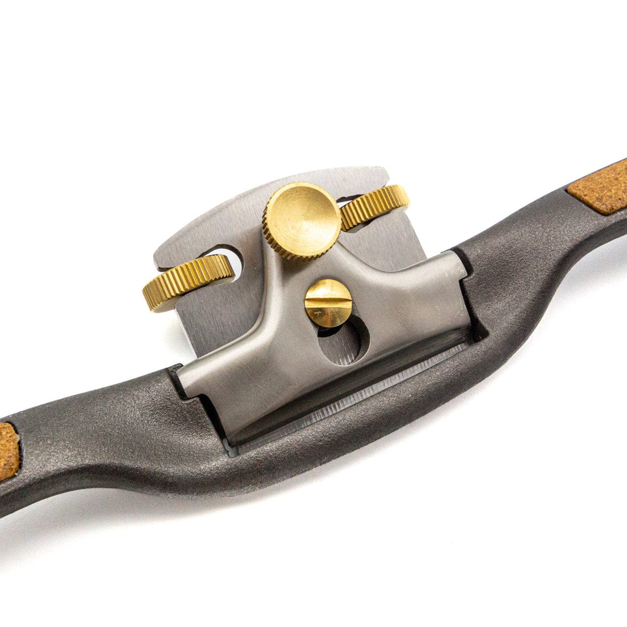 A close-up of the Melbourne Tool Company Sole Spokeshave, a metal woodworking tool by Melbourne Tool Company, featuring brass adjustment knobs and a sharp blade for shaping and smoothing wood surfaces.