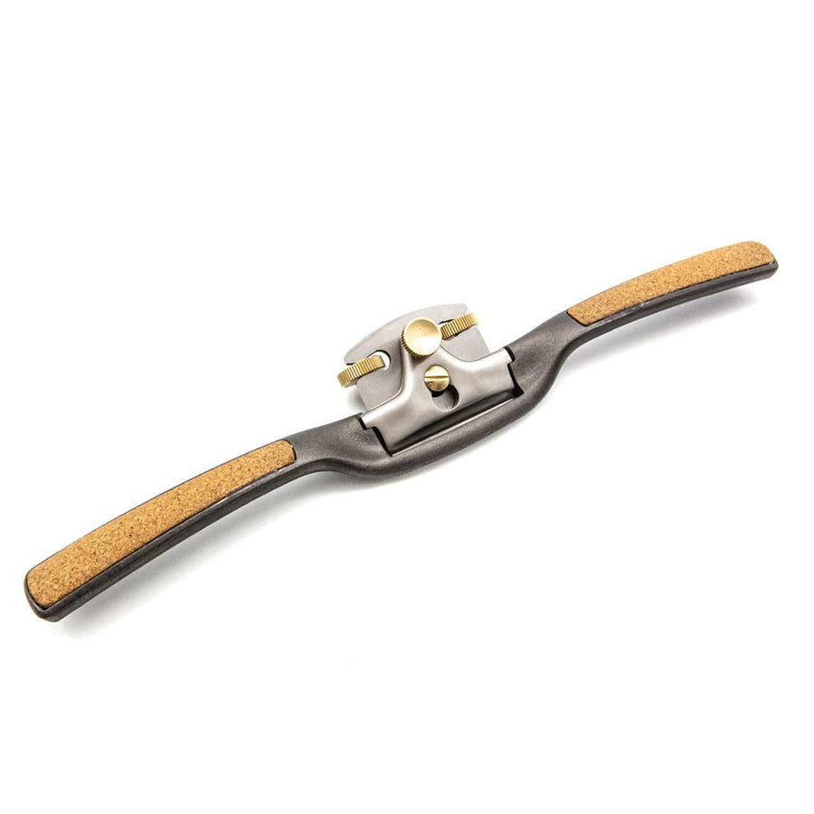 The Melbourne Tool Company Sole Spokeshave is a metal woodworking tool with cork-covered handles and a central adjustable blade, ideal for shaping and smoothing wood where precision is needed.