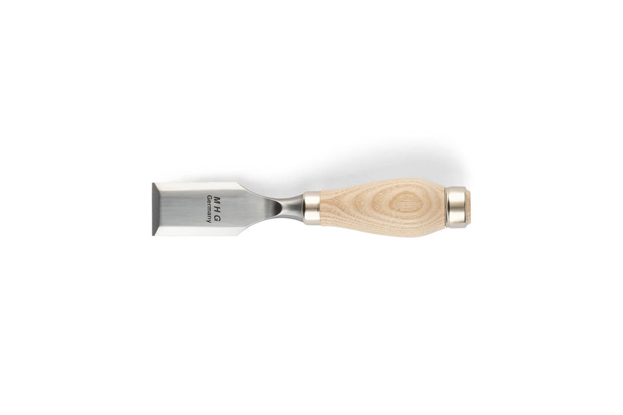 The MHG Butt Chisel by MHG features a wide, flat metal blade and a light wooden handle, ideal for precision woodworking, shown horizontally on a white background.