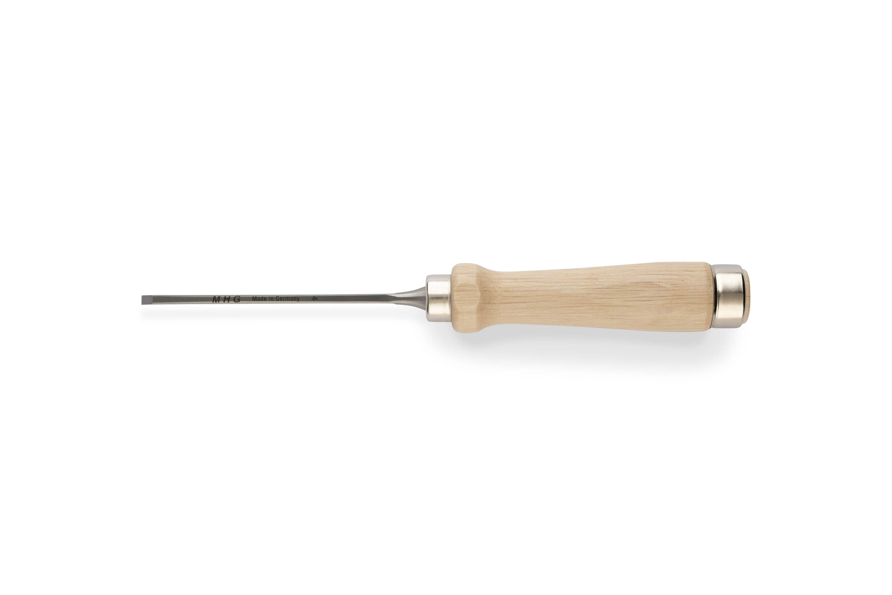 The MHG Firmer Bench Chisel by MHG, featuring a light wooden handle and a narrow, flat blade for fine woodworking, is positioned horizontally on a white background.