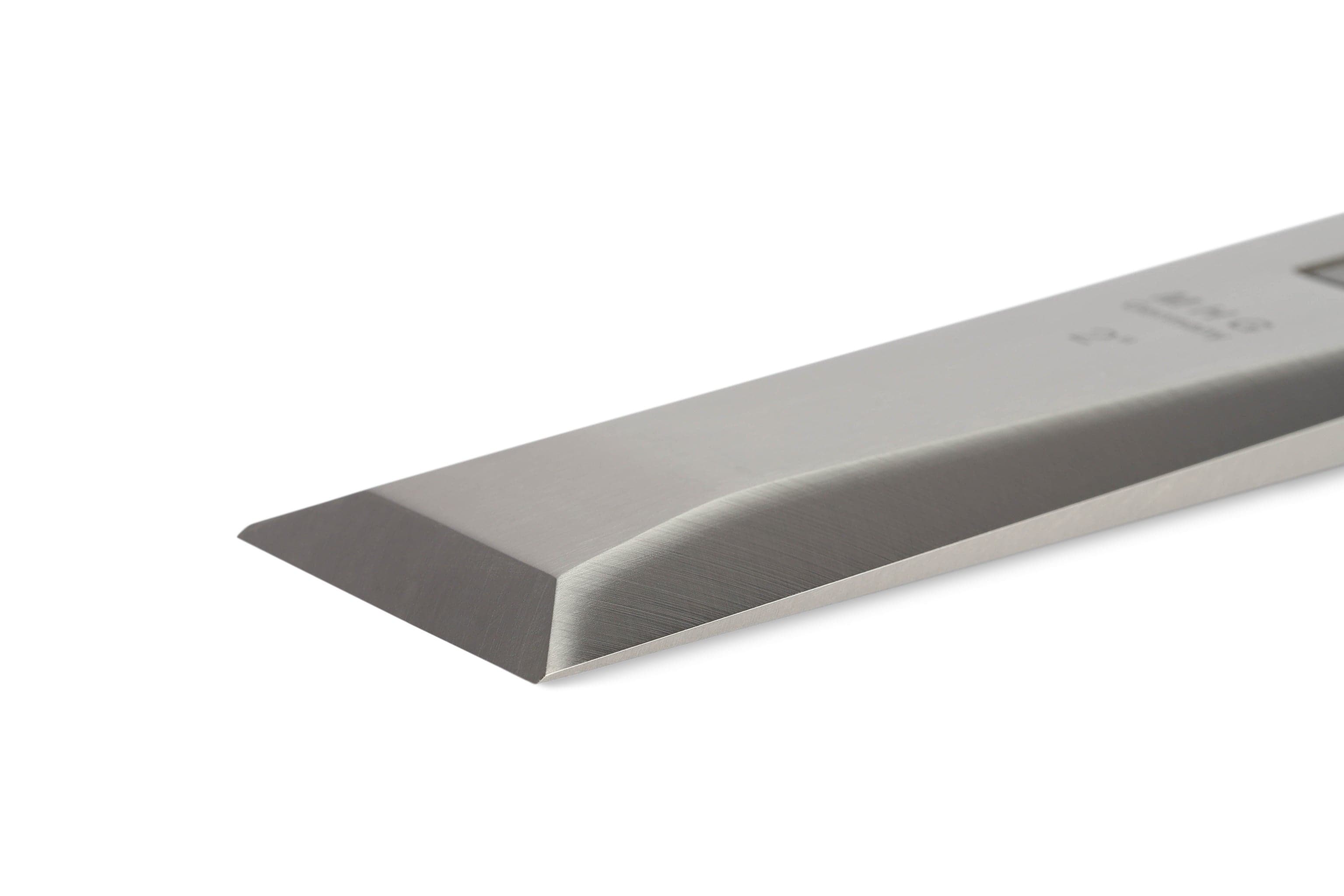 Close-up of the MHG Messerschmidt Timber Framing Chisel featuring a sharp, beveled edge, crafted for professional woodworkers prioritizing superior edge retention, set against a plain white background.