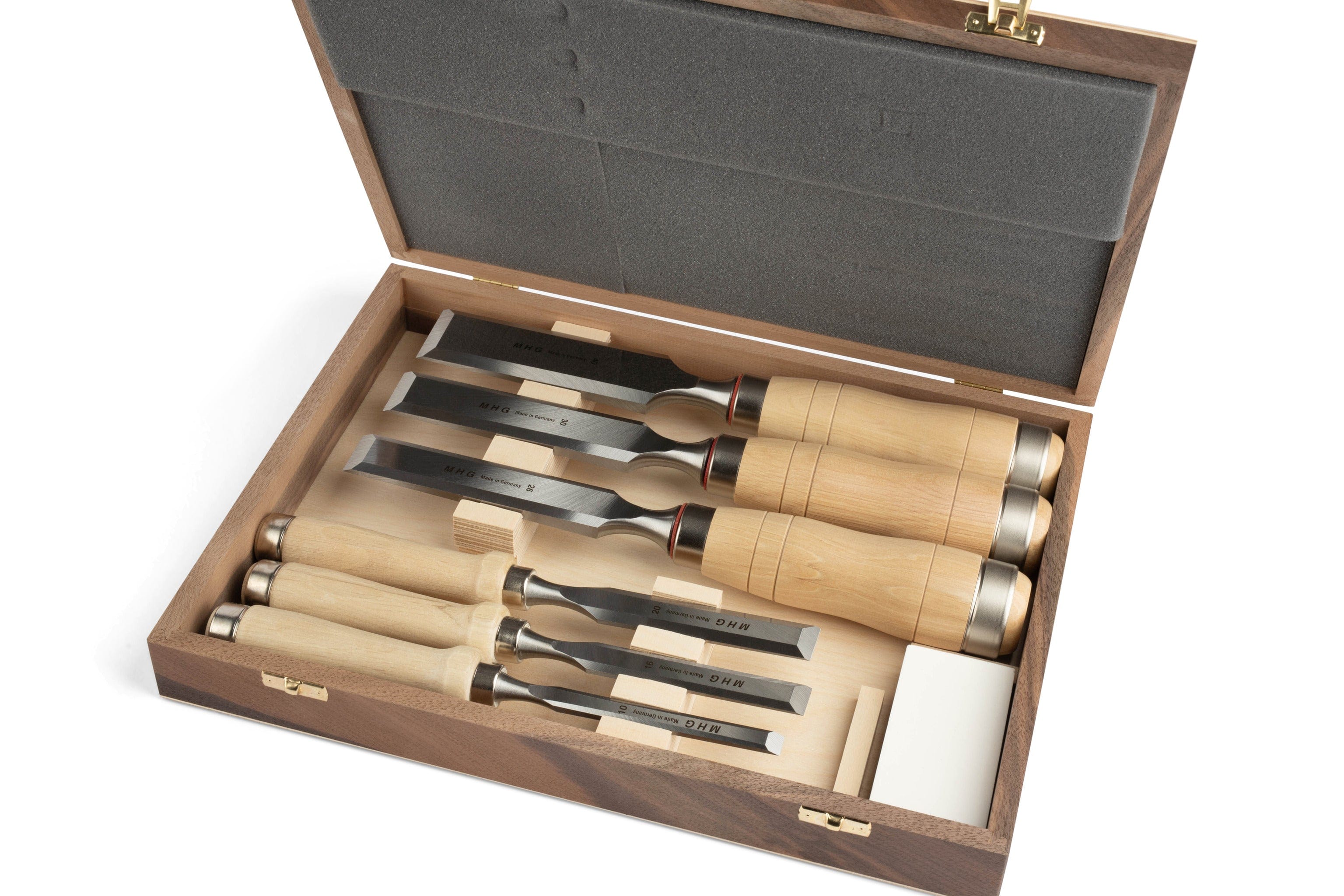 The MHG Carpenter Chisel set by MHG includes six German-engineered chisels with light wooden handles in a foam-padded wooden box—an essential woodworking tool collection for precise craftsmanship.