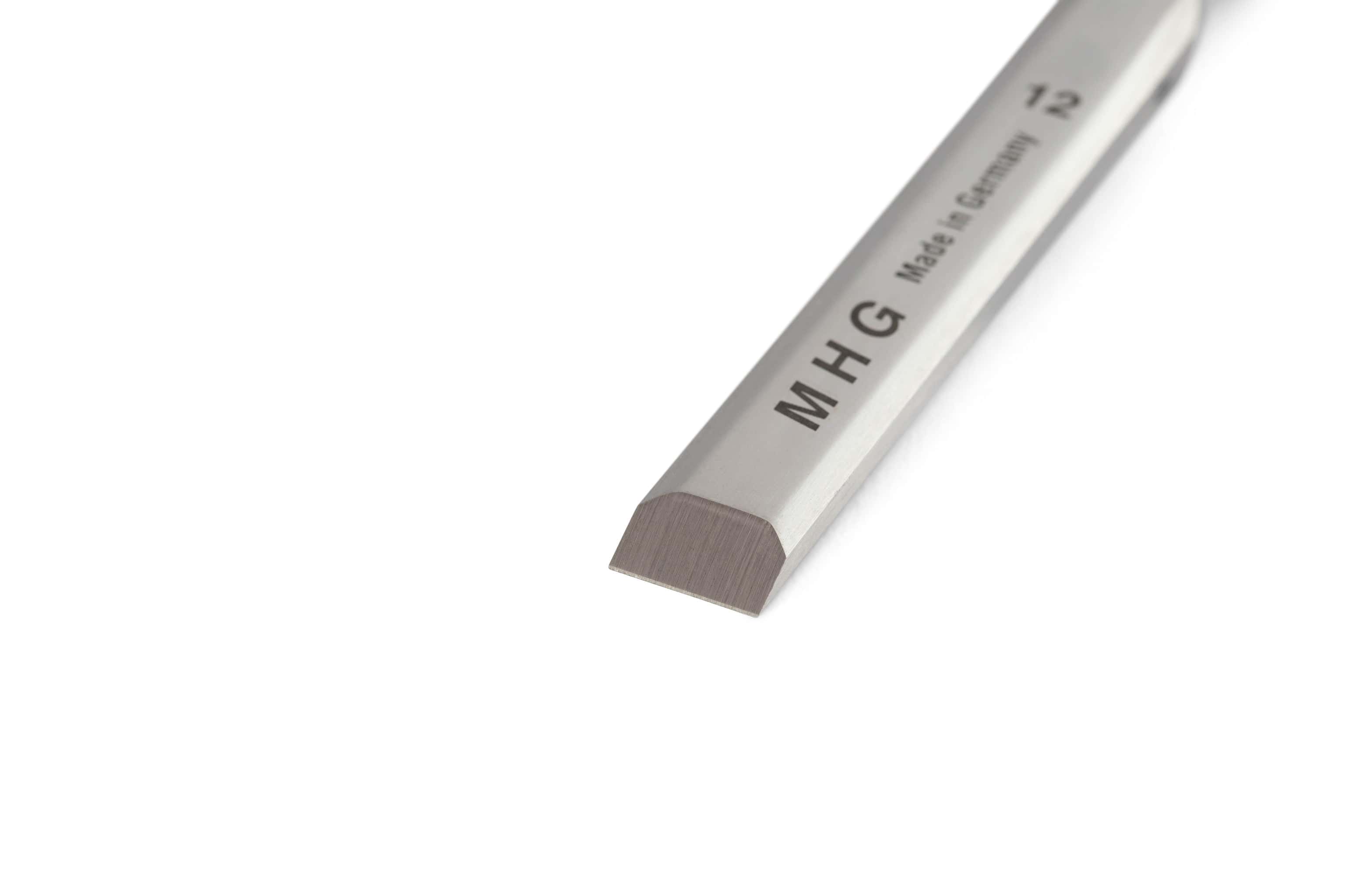 A close-up of an MHG Butt Chisels and Gouges Set woodworking chisel with a beveled, polished alloy-steel blade, marked MHG, 12, and Made in Germany, is shown against a white background.