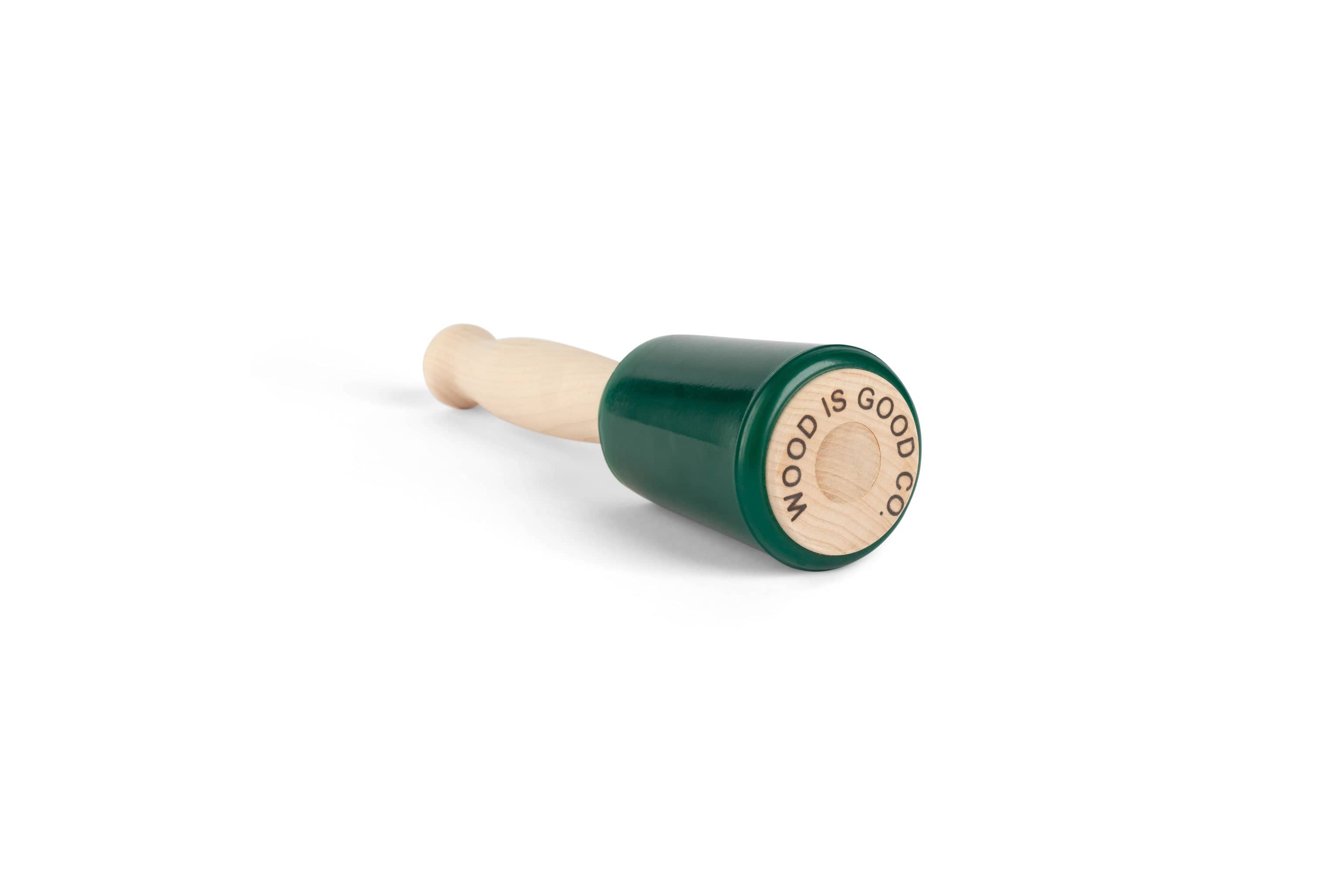 The MID Wood Is Good Mallet features an ergonomic handle and a green rubber head, engraved with WOOD IS GOOD on the end.