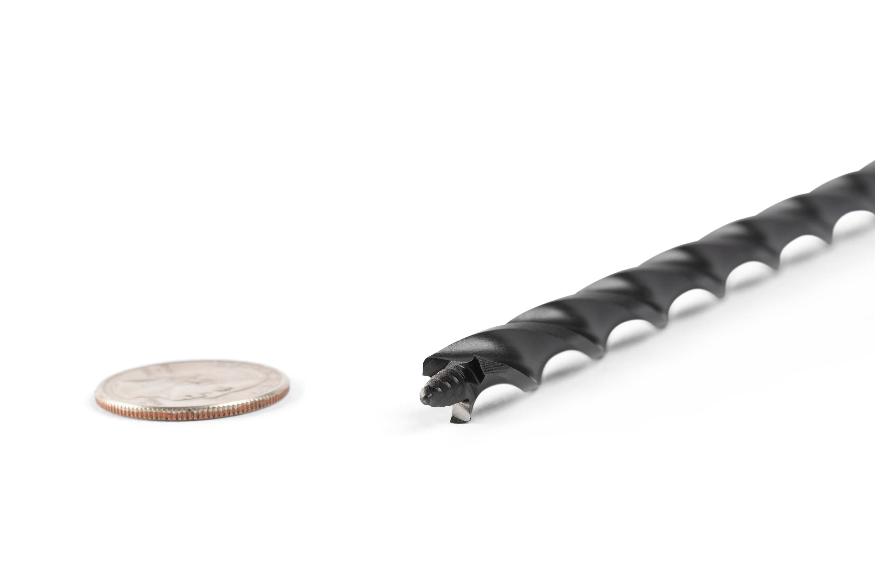 A close-up of the OWL Wood Owl Ultra Smooth Tri-Cut Auger Bit 18-in, made from high-carbon steel, shown beside a quarter on a white background for size comparison.
