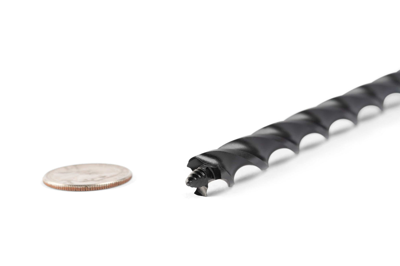 A close-up of the OWL Wood Owl Ultra Smooth Tri-Cut Auger Bit 18-in with a spiral design, high-carbon steel construction, is shown next to a U.S. quarter on a white background.