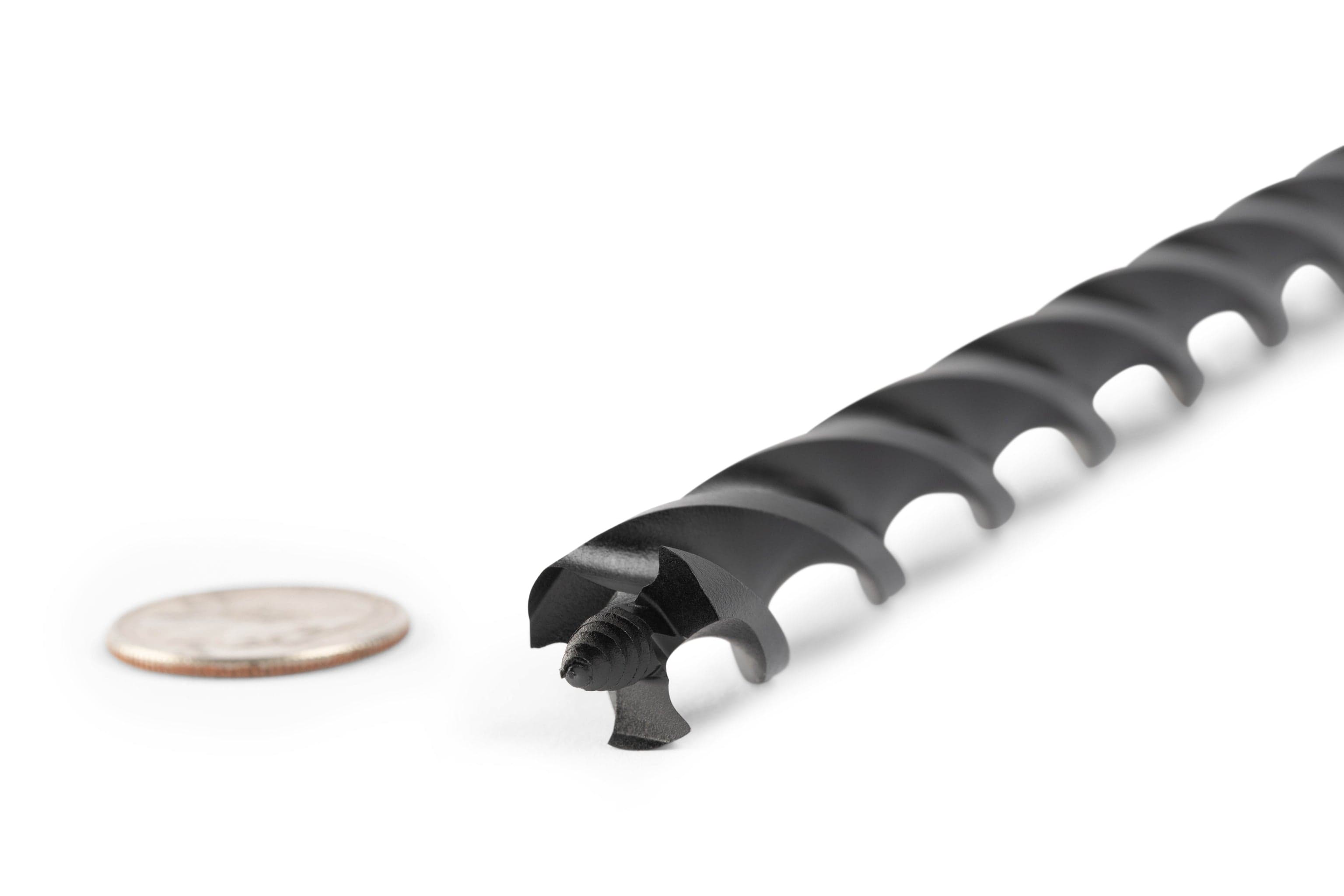 Close-up of an OWL Wood Owl Ultra Smooth Tri-Cut Auger Bit 18-in in black with a spiral design and smooth chip ejection, partially cut to show its cross-section, placed beside a U.S. quarter for scale on a white background.