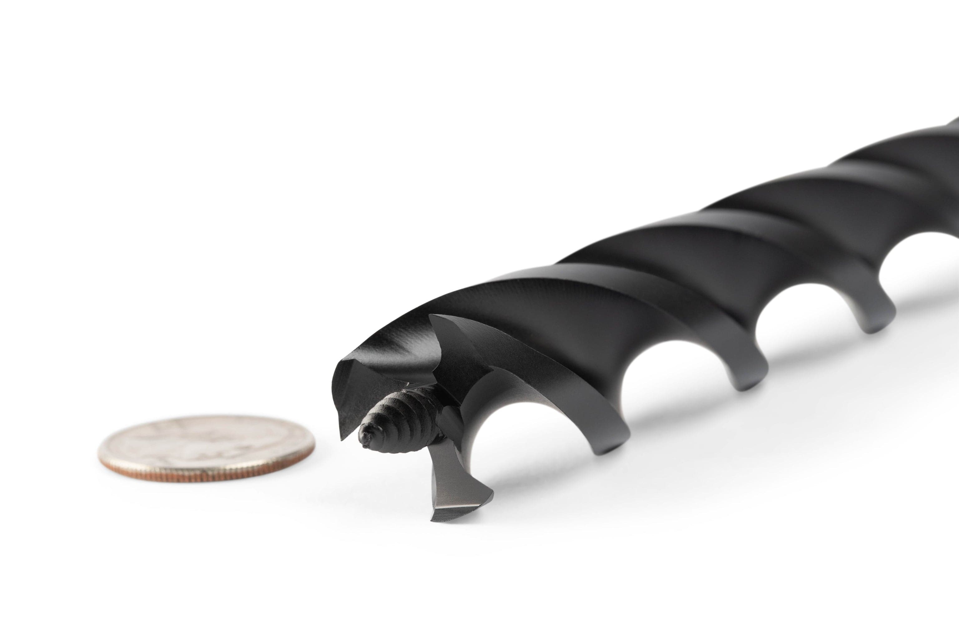 A close-up of the OWL Wood Owl Ultra Smooth Tri-Cut Auger Bit 18-in, crafted from high-carbon S55C steel, next to a silver coin on a white background.