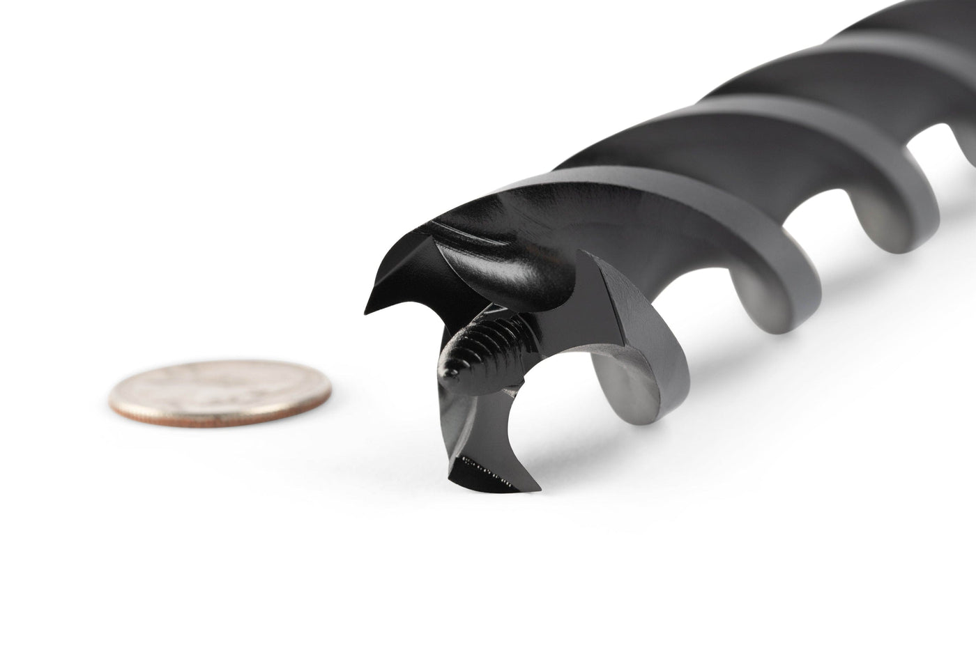Close-up of an 18-in OWL Wood Owl Ultra Smooth Tri-Cut Auger Bit, featuring a screw-shaped tip made from high-carbon S55C steel, lying next to a coin for size comparison.