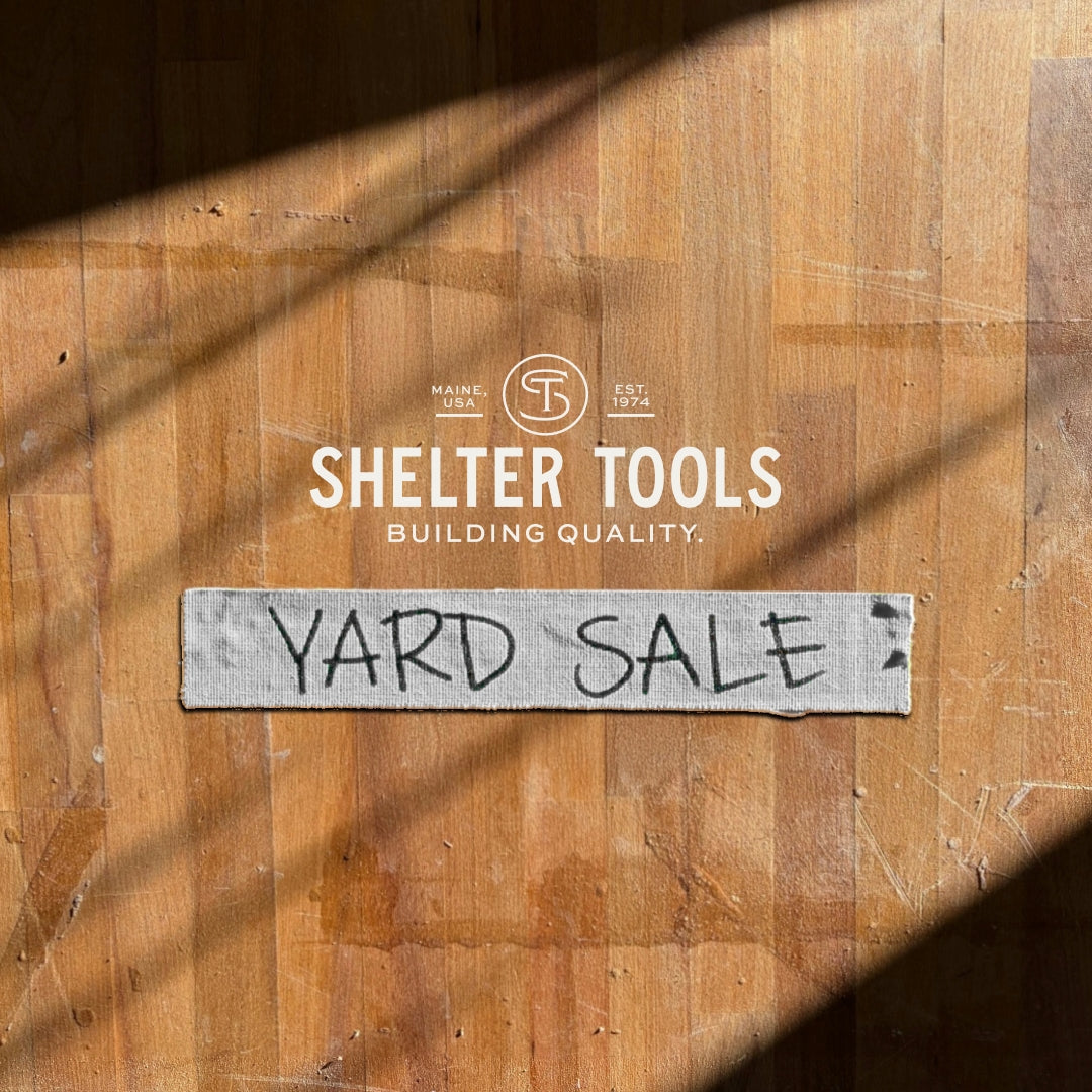 A wood background with masking tape on top featuring the words Yard Sale and the Shelter Tools logo. This is a placeholder image for products that don't have one. 