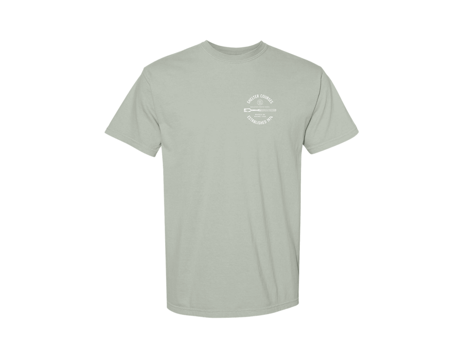 The Shelter Courses Time Quote T-Shirt by Riptide Print Company is a light gray heavyweight cotton tee featuring a small white graphic of crossed oars with "Shelter Courses" in a circle on the left chest.
