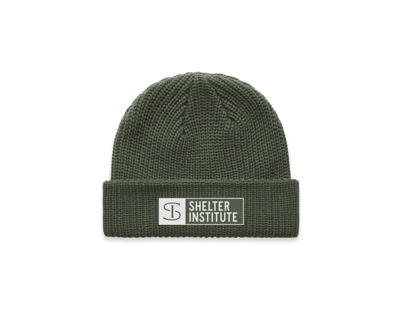 The Shelter Institute Fisherman's Beanie by Riptide Print Company is an olive green, classic Maine fisherman's beanie with a folded brim, a rectangular Shelter Institute patch, and a circular logo—perfect for timber frame fans.