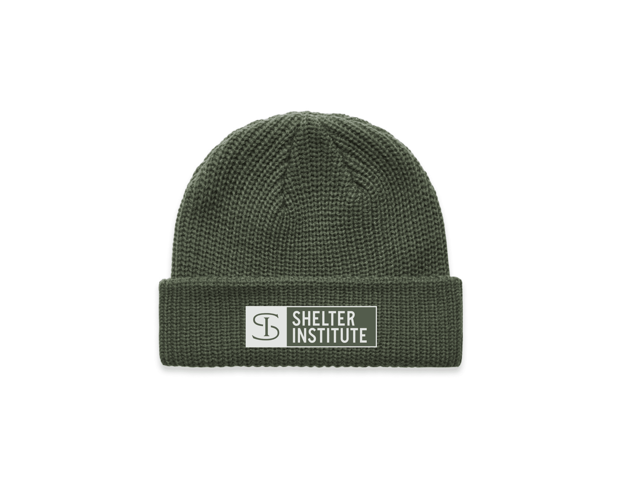 The Shelter Institute Fisherman's Beanie by Riptide Print Company is an olive green, classic Maine fisherman's beanie with a folded brim, a rectangular Shelter Institute patch, and a circular logo—perfect for timber frame fans.