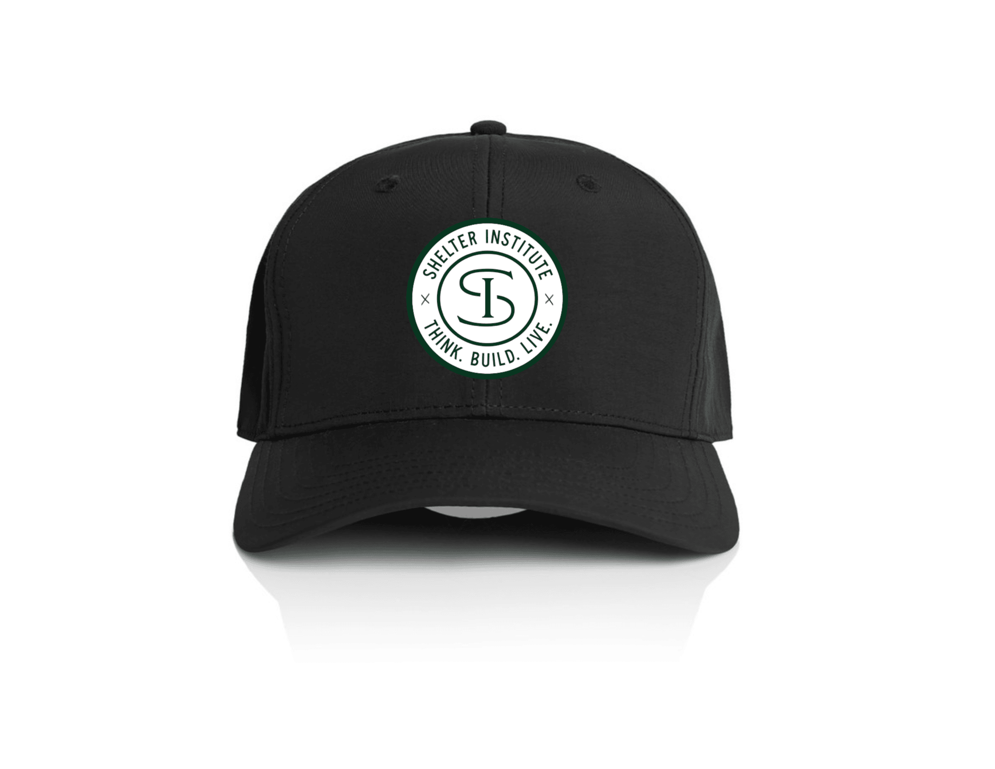 The Shelter Institute Nylon Dad Cap by Riptide Print Company features a circular white logo reading Shelter Institute and Think. Build. Live. around a stylized "SI" on the front, inspired by timber frame craftsmanship, shown against a white background.