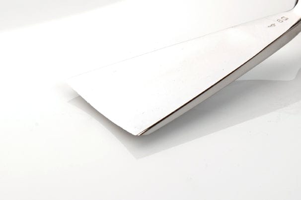 A close-up of the ROB Two Cherries Swiss Pattern Fish Tail Gouge with an octagonal hornbeam handle on a white surface.