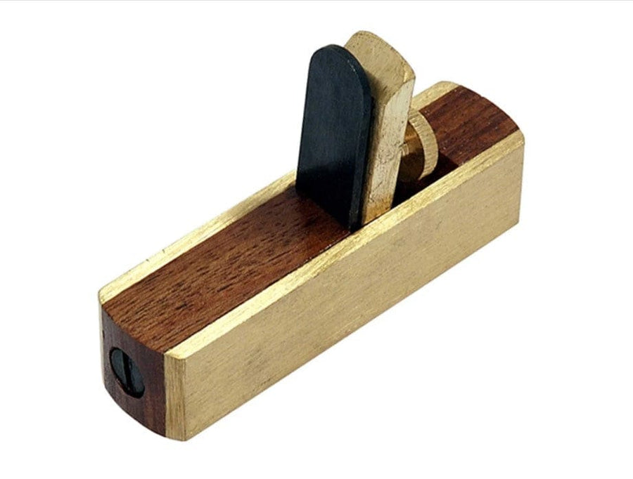 The ROB Miniature Scraper Plane features a wood and brass build with a carbon steel blade and wedge, ideal for fine woodworking and smoothing small surfaces.