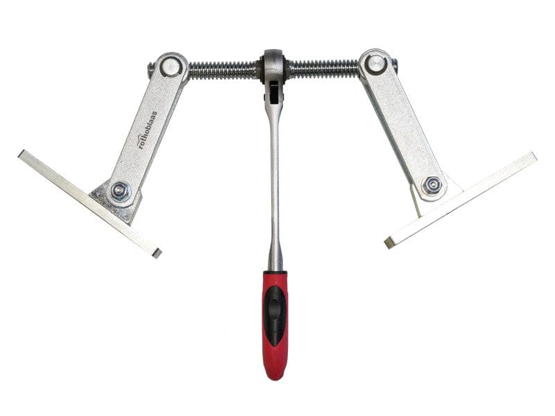 The Rothoblaas Geko Panel Puller by Rothoblaas features a central screw mechanism, two adjustable arms with flat ends, and a red and black handle for precise assembly of solid timber panels.