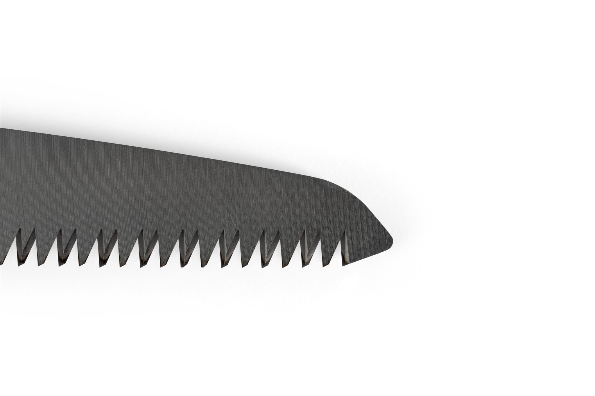 Close-up of the serrated edge of a dark-colored sht Silky F180 Folding Saw blade with interchangeable blades, set against a white background.