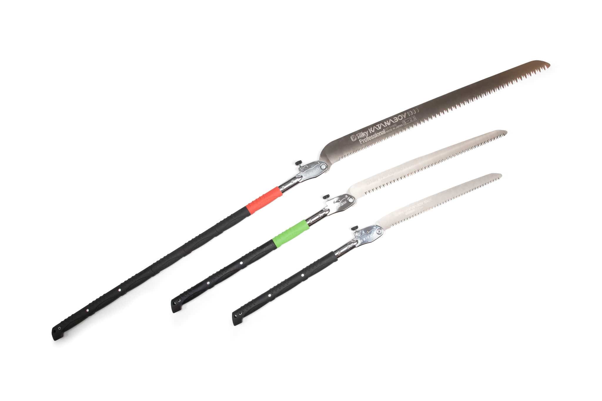 Three extendable SHT Silky Katana Boy pruning saws with black handles and long, serrated blades are arranged diagonally on a white background. The handles have colored bands—red, green, or none—near the base.
