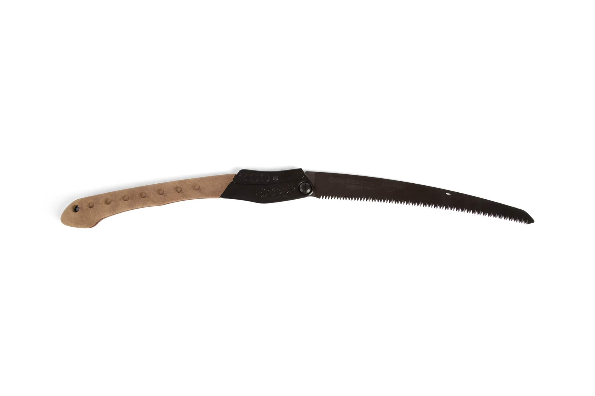 The SHT Silky Outback Folding Saw is a durable tool with a light brown wooden handle and a curved, partially open black blade with fine teeth, shown isolated on a white background.
