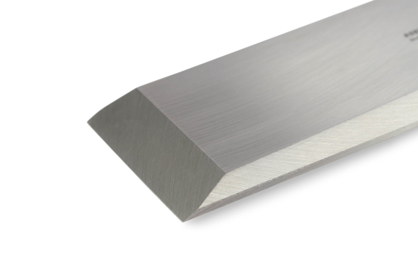 Close-up of the gleaming Sheffield Steel blade of a SOR Robert Sorby Bevelled Framing Chisel, showcasing its beveled edge on a white background.