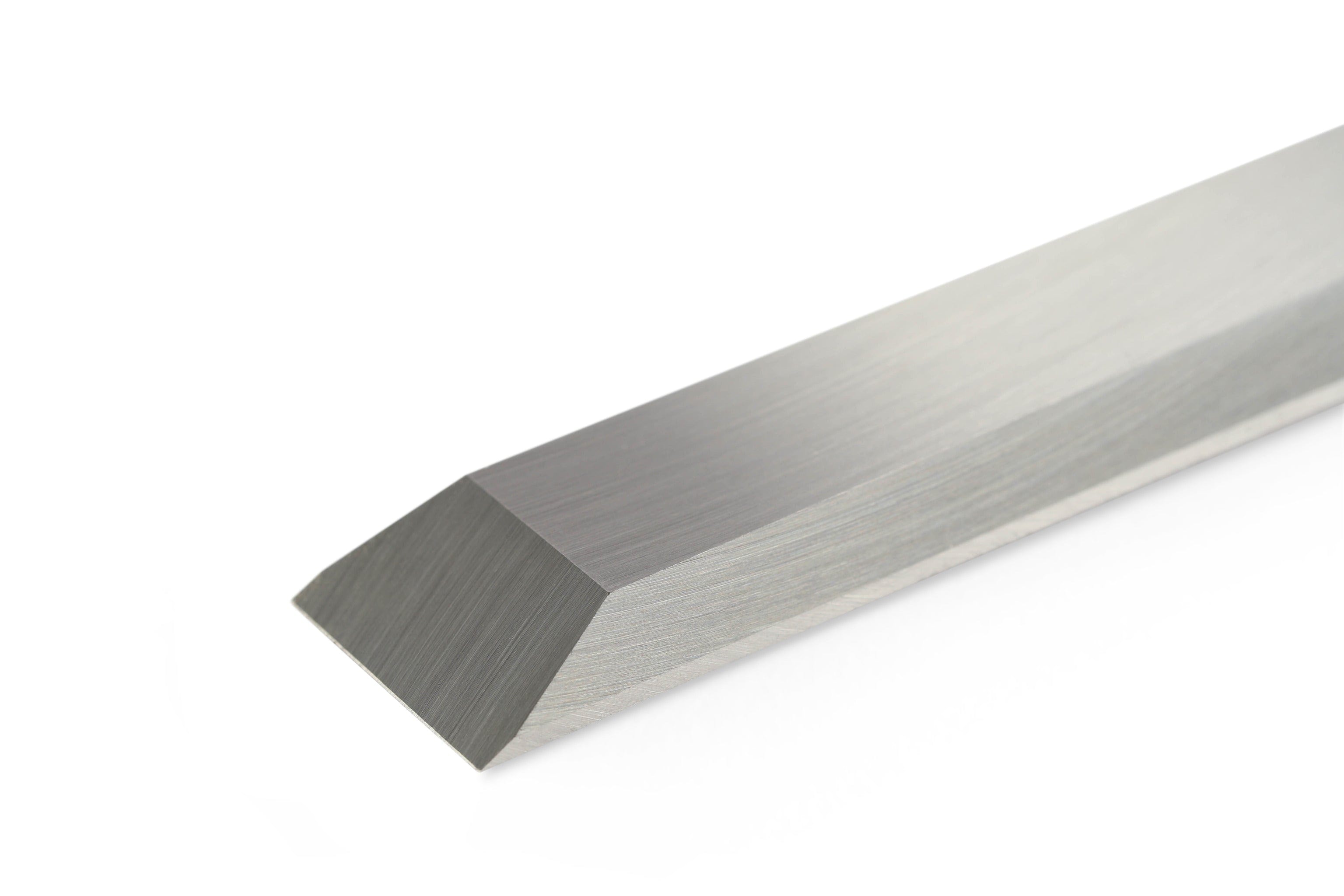 Close-up of a sharp, metallic rectangular prism with a beveled edge on a white background, reflecting the precision of the SOR Robert Sorby Bevelled Framing Chisel made from finest Sheffield Steel.