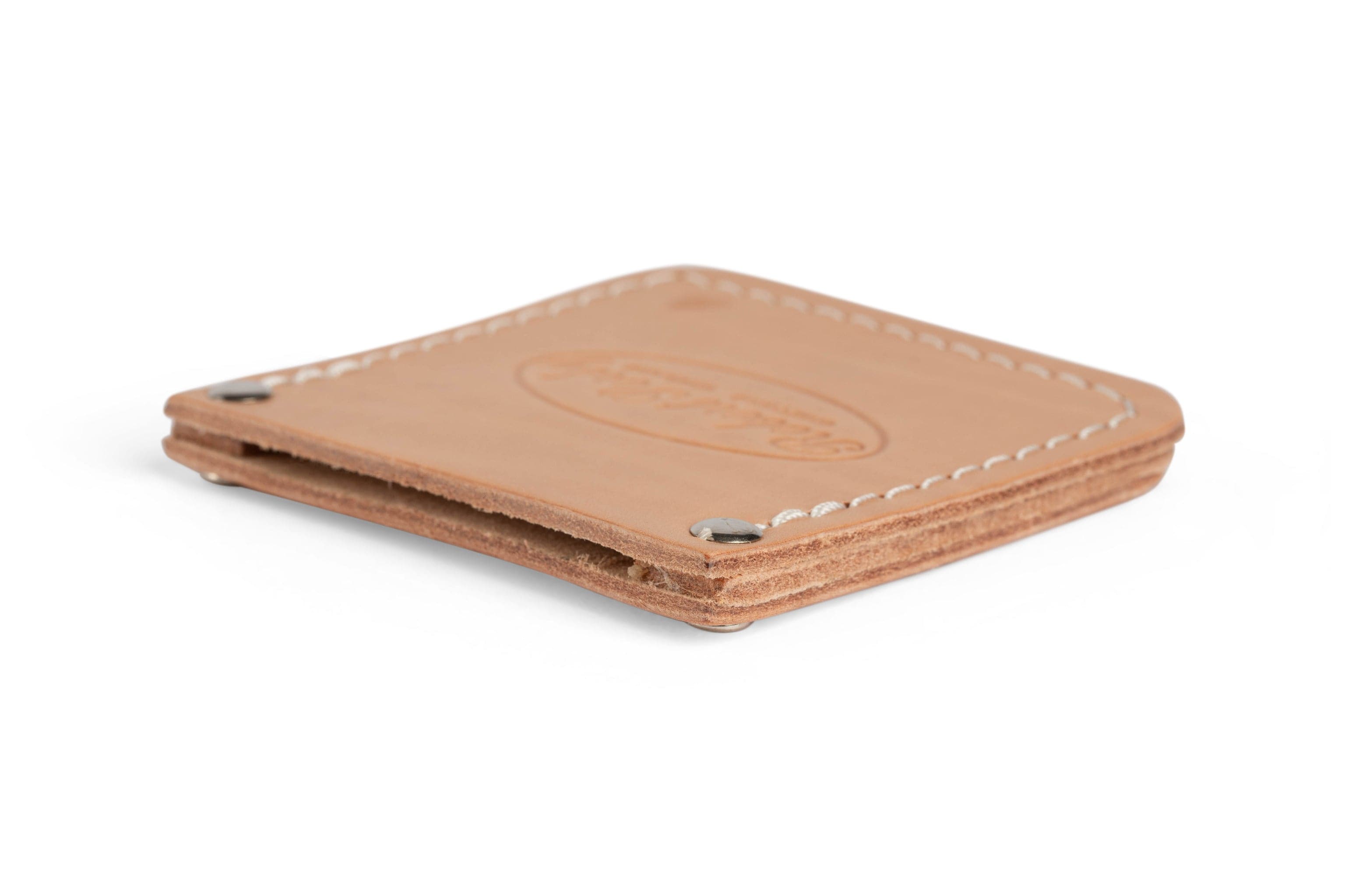 A folded tan leather wallet with visible stitching and metal accents at the corners features SORs Robert Sorby Leather Edge Guard for enhanced durability.