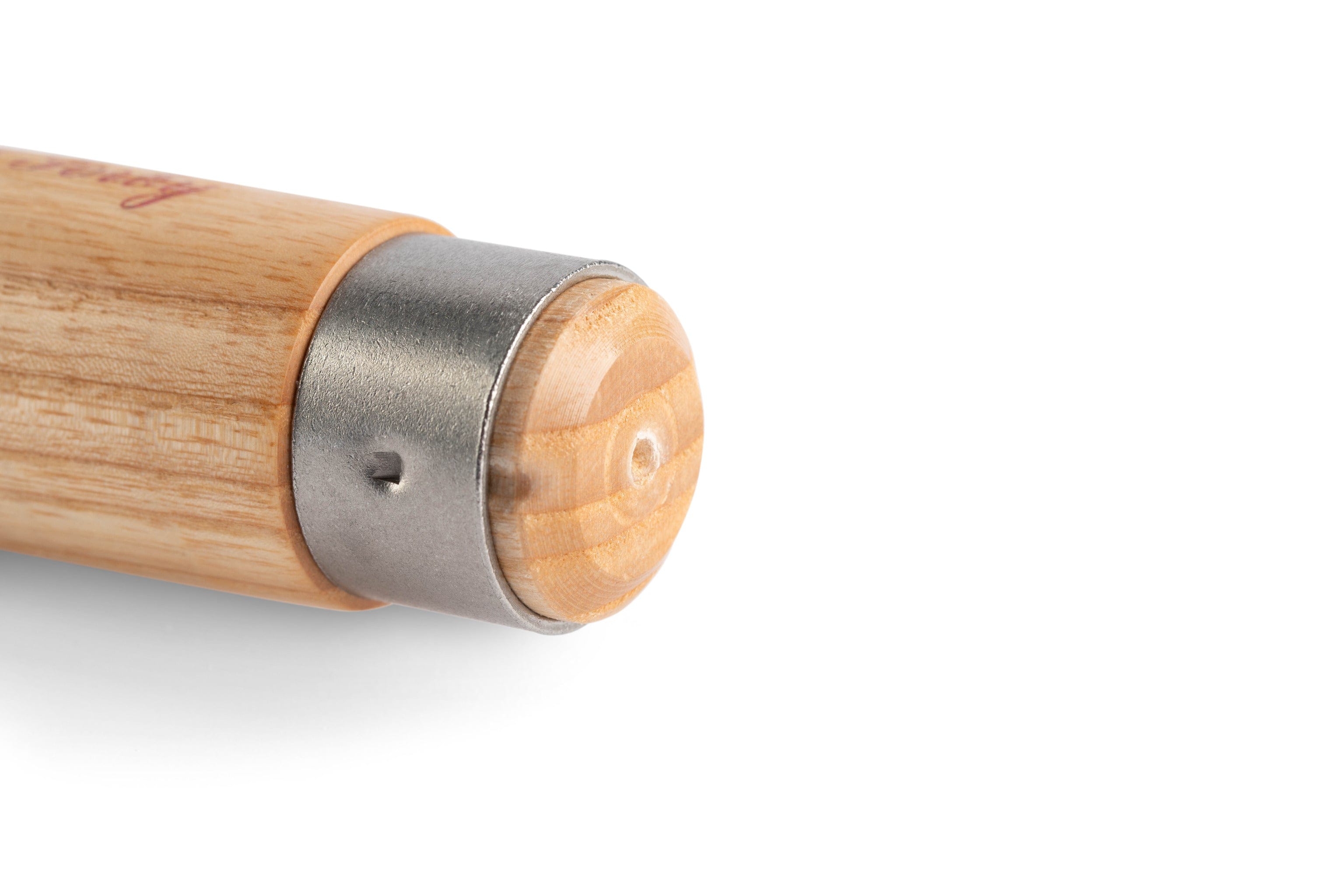 A detailed view of a wooden tool handle with a metal collar and a small hole, echoing the craftsmanship of woodworker tools such as the SOR Robert Sorby Skew Chisel Set.